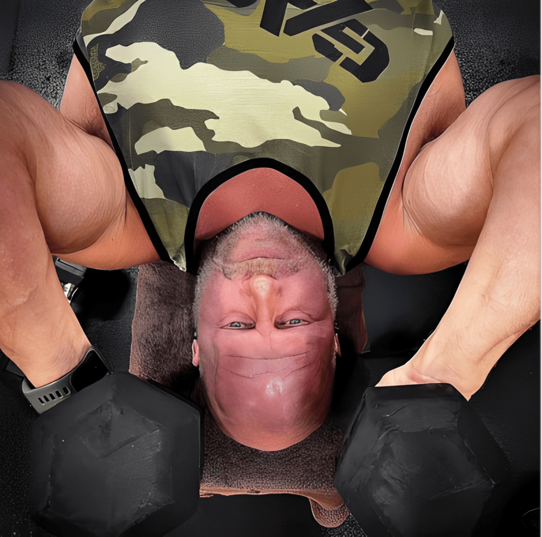 Man lifting dumbbells in a gym.
